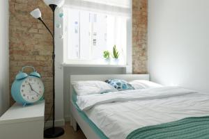 Posteľ alebo postele v izbe v ubytovaní Apartament Wilda Nova