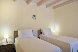 A bed or beds in a room at Villa Stylianna Még 18 kép