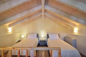 A bed or beds in a room at Villa Stylianna