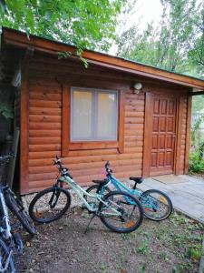 a group of bikes parked outside of a cabin at Szőlősi Diófa Vendégház in Balatonszőlős