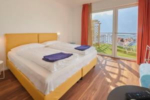 Voodi või voodid majutusasutuse Hotel Paradiso Conca d'Oro toas