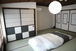 a room with a bed with a checkered floor at Takayama - House - Vacation STAY 89815 in Takayama