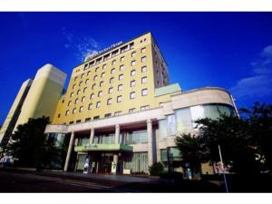 a large white building with a lot of windows at Hotel Verfort Hyuga - Vacation STAY 88276 in Hyuga