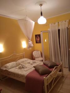 Posteľ alebo postele v izbe v ubytovaní Spiti Mitsis