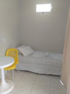Postel nebo postele na pokoji v ubytování Casa Temporada Suítes