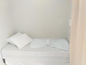 Postel nebo postele na pokoji v ubytování Casa Temporada Suítes
