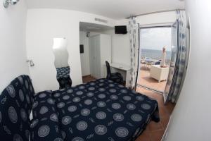 Кровать или кровати в номере Yachting Club Mare