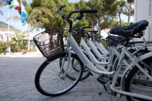 a row of bikes parked next to each other at Yachting Club Mare in Patti