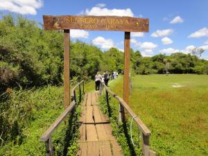 a sign for the sanjeev garcia creek trail at Iberá Porá in Colonia Carlos Pellegrini +25 photos