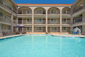a large swimming pool in a large building at Best Western San Diego/Miramar Hotel in Miramar