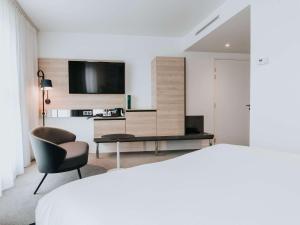Cama ou camas em um quarto em Novotel Angers Centre Gare