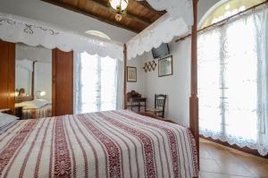 Postel nebo postele na pokoji v ubytování Naxos Filoxenia Hotel