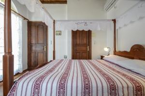 Postel nebo postele na pokoji v ubytování Naxos Filoxenia Hotel