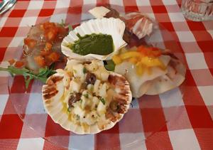 a plate of food on a red and white checked table cloth at Monterosso al Mare 20 in Monterosso al Mare