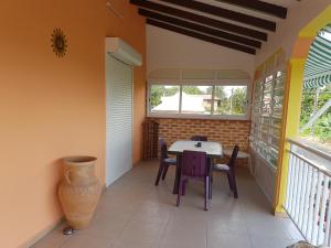 Balkón nebo terasa v ubytování Domaine fleurs de bananes