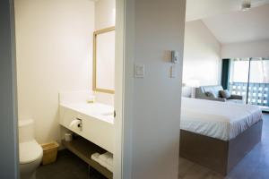 Postel nebo postele na pokoji v ubytování Sand Pebbles Inn