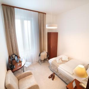 Postel nebo postele na pokoji v ubytování Hotel KOZÁK