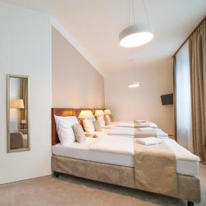 Postel nebo postele na pokoji v ubytování Hotel KOZÁK