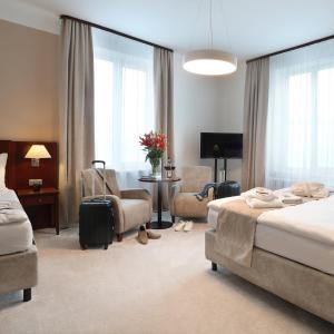Postel nebo postele na pokoji v ubytování Hotel KOZÁK