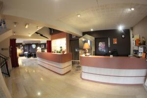 a lobby with a bar in a restaurant at Auberge De Bourgogne in Tonnerre