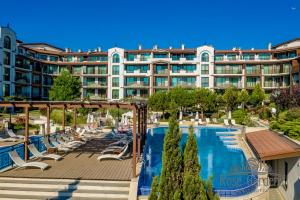 a hotel with a swimming pool and a resort at Rose Gardens Apart Hotel in Pomorie