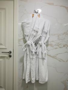 a group of white towels hanging on a wall at Azzap Hotel Galata in Istanbul +50 photos