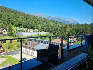 a balcony with chairs and a view of a mountain at Vintage Home in Sinaia