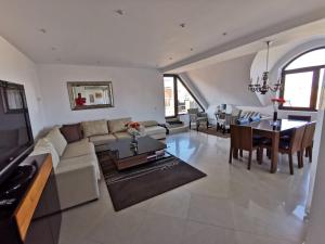a living room with a couch and a table at Sun Sea Resort in Ravda