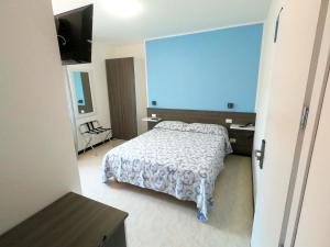 Postel nebo postele na pokoji v ubytování Hotel Aurora