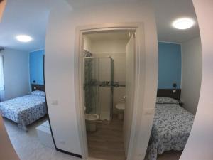 Postel nebo postele na pokoji v ubytování Hotel Aurora