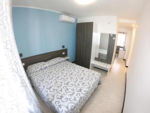 Postel nebo postele na pokoji v ubytování Hotel Aurora