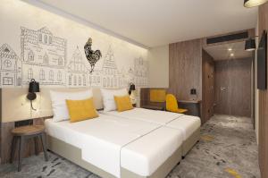 Posteľ alebo postele v izbe v ubytovaní ibis Styles Lublin Stare Miasto