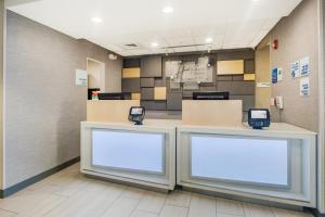 a waiting area at a hospital with two blank signs at Holiday Inn Express Hotel & Suites Orlando - Apopka, an IHG Hotel in Orlando