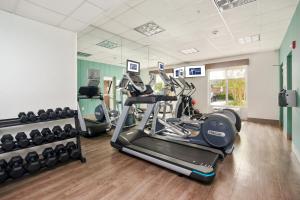 a gym with two treadmills and a treadmill at Holiday Inn Express Hotel & Suites Orlando - Apopka, an IHG Hotel in Orlando