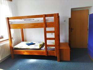 Postel nebo postele na pokoji v ubytování Chata Šumná