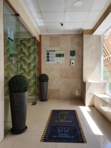 a bathroom with a welcome mat on the floor at Hotel Centro Mar in Benidorm