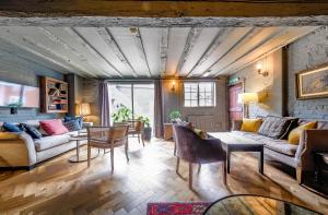 a living room with a couch and a table at The Westleton Crown in Westleton