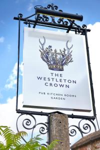 a sign for the westbury grown on a building at The Westleton Crown in Westleton