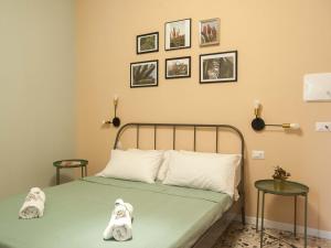 Letto o letti in una camera di Four Rooms Alghero