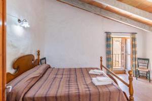 Postel nebo postele na pokoji v ubytování Ses Cases Noves + 14 fotografií
