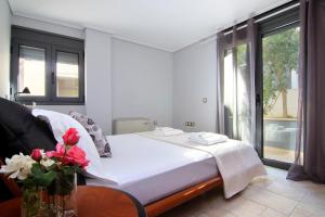 Postel nebo postele na pokoji v ubytování Adam & Eve Villas