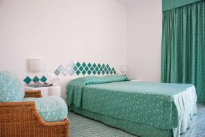 Postel nebo postele na pokoji v ubytování Hotel Torre Oliva