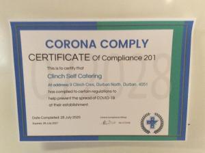un diploma con un certificado de conformidad en una pared en Clinch Self Catering, en Durban
