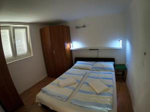 Llit o llits en una habitació de Apartment Mini