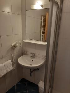 a bathroom with a sink and a mirror at Haus Achenrainer in Fiss +25 photos