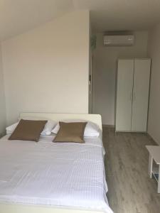 Postel nebo postele na pokoji v ubytování Guesthouse Davorka Bijelić