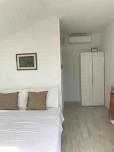 Postel nebo postele na pokoji v ubytování Guesthouse Davorka Bijelić
