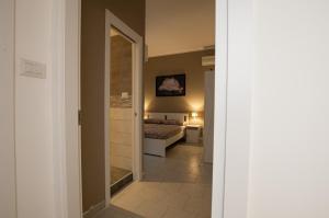 A bed or beds in a room at Living Salerno B&b