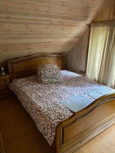 Postel nebo postele na pokoji v ubytování Šeimyninis namelis nr.2