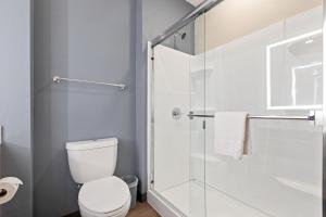 a bathroom with a toilet and a glass shower at Extended Stay America Premiere Suites - Ukiah in Ukiah